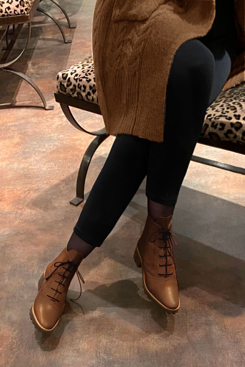 Caramel brown women's ankle boots with laces at the front. Round toe. Low rubber soles. Worn view - Florence KOOIJMAN